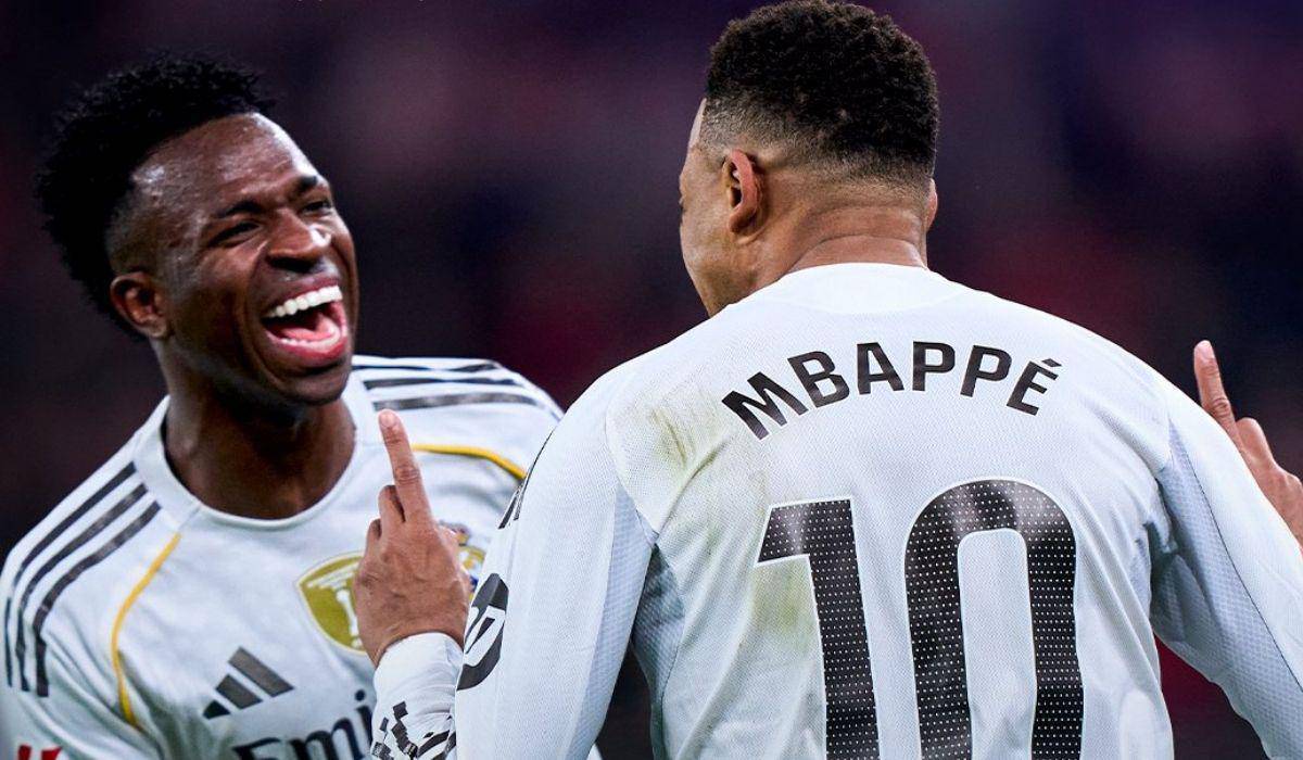 Vinicius Junior comemora o gol marcado pelo Real Madrid contra o Benfica, na Champions League.